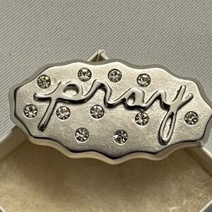Pray Hard silver pin with rhinestones by Art Gallery of Ontario
